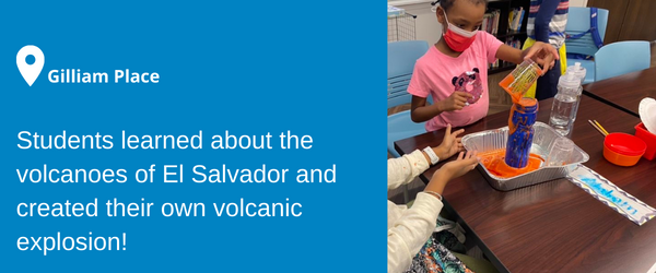 A girl emptying a cup into a water bottle overflowing with orange liquid at Gilliam Place. Students learned about the volcanoes of El Salvador and created their own volcanic explosion!