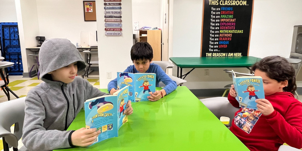 3 boys reading